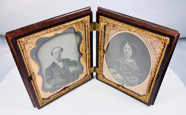 Cased nineteenth-century ambrotype portraits with decorative brass surrounds