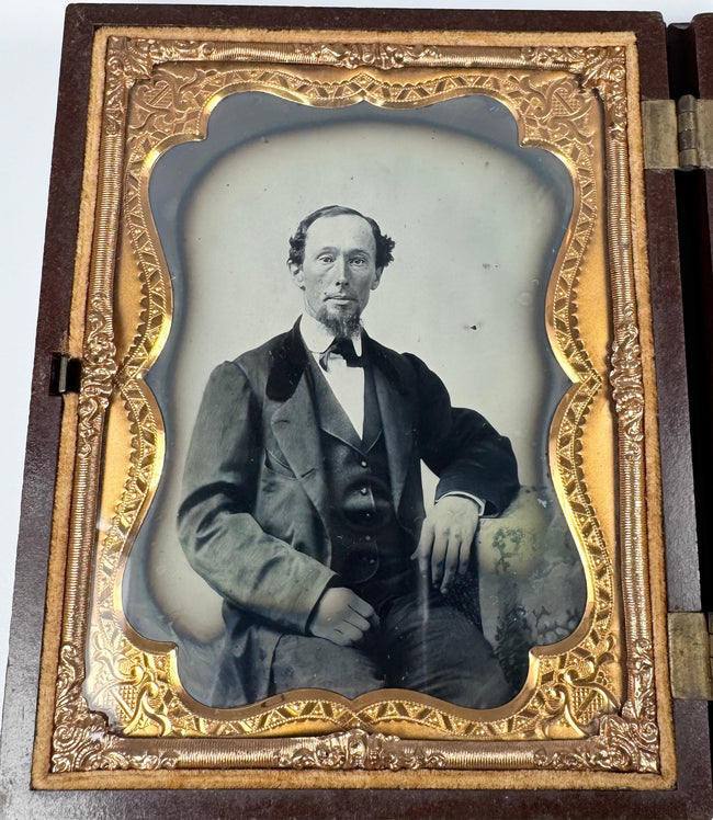 Two original glass ambrotypes housed in a molded floral union case
