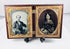 Rotating view of a mid-19th-century double ambrotype set with portraits of a Victorian gentleman and young woman, gilt brass mats, velvet lining, and an ornate molded thermoplastic union case