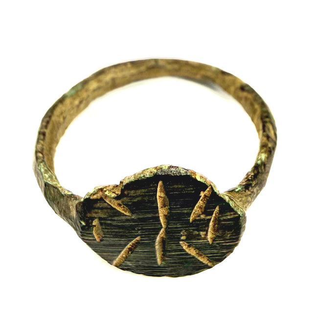 Ancient Byzantine bronze ring showing oval bezel with deeply engraved radiating linear motif