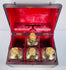 19th century British mahogany decanter box with fitted compartments and original parcel-gilded spirit bottles
