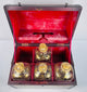 19th century British mahogany decanter box with fitted compartments and original parcel-gilded spirit bottles