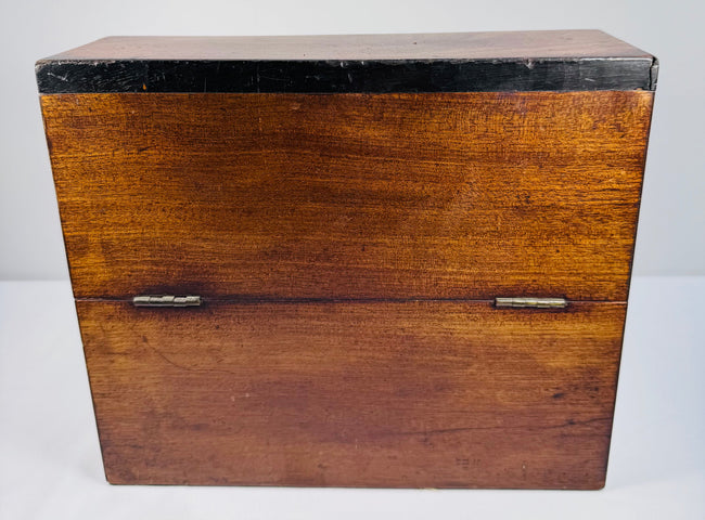 Georgian mahogany decanter box exterior with curved hinged lid and naturally aged wood grain