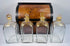 Early 19th century Georgian mahogany spirit box with four parcel-gilded glass decanters and red fitted interior