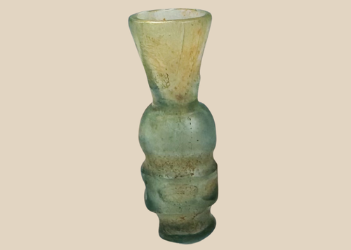 Miniature Early Islamic pale blue-green glass vessel with flared trumpet-shaped neck