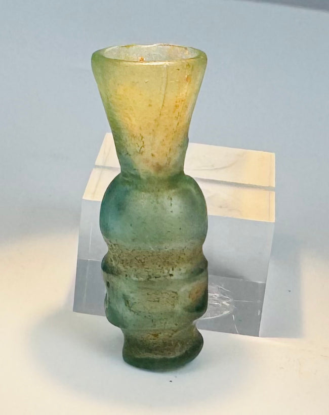 Medieval Islamic blown glass perfume or cosmetic bottle with globular body