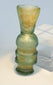 Western Asian blown glass vessel with rounded central body and tubular lower section