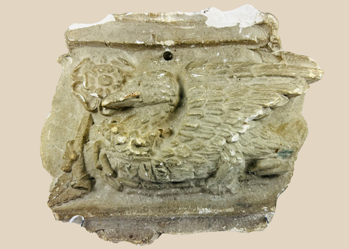 Early 20th-century plaster relief of a medieval griffin with wings, referencing Westminster Coronation 1902