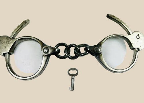 Early 20th-century U.S. handcuffs with key, based on Tower Detective design