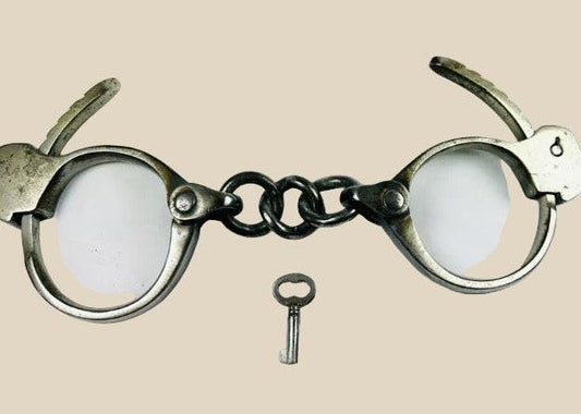 Early 20th-century U.S. handcuffs with key, based on Tower Detective design
