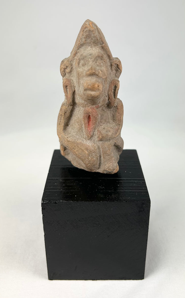 3rd–6th century CE South Asian terracotta figurine, hand-molded anthropomorphic votive figure from Northern India, with stylized facial features and traces of pigment, mounted on display base