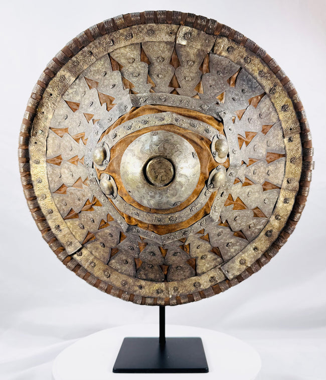 Imperial Ethiopian hide shield with gilt and silvered bosses on velvet