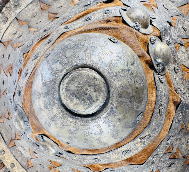 Detail of the large central boss with radiating foliate decoration on an Ethiopian shield