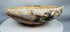 Byzantine ceramic slipware bowl featuring a central medallion motif and concentric decorative bands.