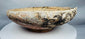 Byzantine ceramic slipware bowl featuring a central medallion motif and concentric decorative bands.