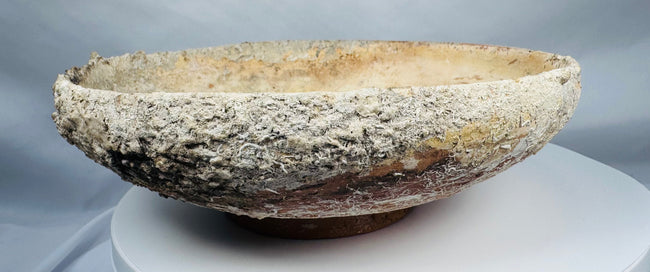 Authentic Byzantine pottery bowl displaying marine encrustations and archaeological mineral deposits.