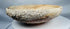 Authentic Byzantine pottery bowl displaying marine encrustations and archaeological mineral deposits.