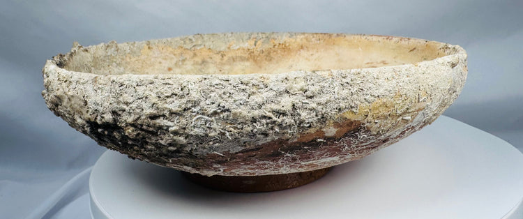 Authentic Byzantine pottery bowl displaying marine encrustations and archaeological mineral deposits.