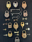 Historic padlocks and keys exhibit mounted in shadow box with mixed metal finishes