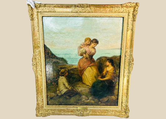 Victorian oil painting “Happy Moments” by Edward John Cobbett R.B.A., depicting a mother holding her child with figures in a rural coastal setting, framed in ornate gilt gesso, England, circa 1860–1880.