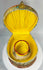 Decorative celluloid collar case with pleated silk interior and collar holder insert