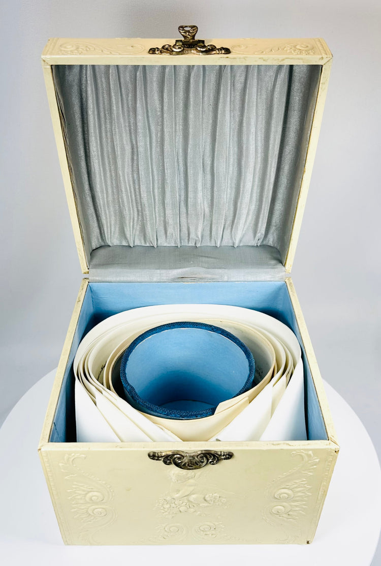 Edwardian era collar box with floral relief and classic menswear accessories