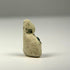 Ancient Egyptian seated cat charm in glazed faience, dating to approximately 600–200 BCE and showing age-related glaze loss.