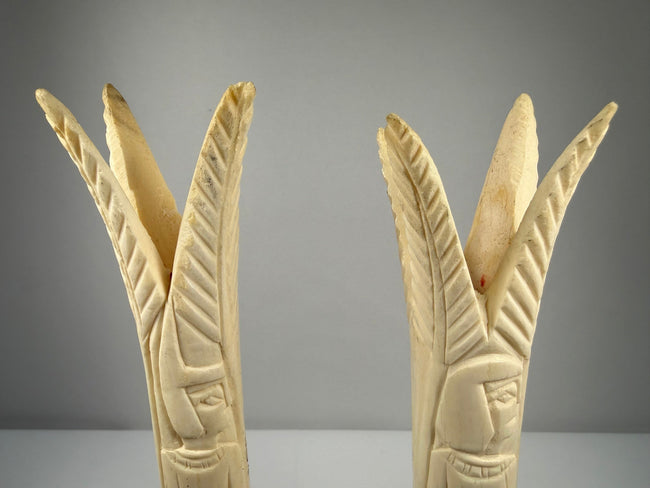 Carved bone lotus and papyrus candlesticks reflecting ancient Egyptian decorative traditions