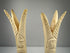 Carved bone lotus and papyrus candlesticks reflecting ancient Egyptian decorative traditions
