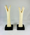 1070–664 BCE Egyptian ivory sistrum handles, Third Intermediate Period, carved stylized figures on display bases