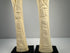 Egyptian decorative bone candlesticks featuring sacred lotus and papyrus plant designs