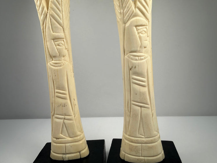 Egyptian decorative bone candlesticks featuring sacred lotus and papyrus plant designs