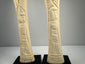 Egyptian decorative bone candlesticks featuring sacred lotus and papyrus plant designs