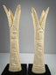 Early 20th-century Egyptian revival bone candlesticks inspired by lotus and papyrus symbolism
