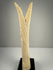 1. Egyptian revival pair of carved bone candlestick holders with preserved detail and black bases
