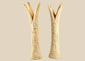 Pair of carved Egyptian ivory sistrum handles on black display bases, featuring stylized figures and decorative motifs, dating to the Third Intermediate Period, circa 1070–664 BCE.