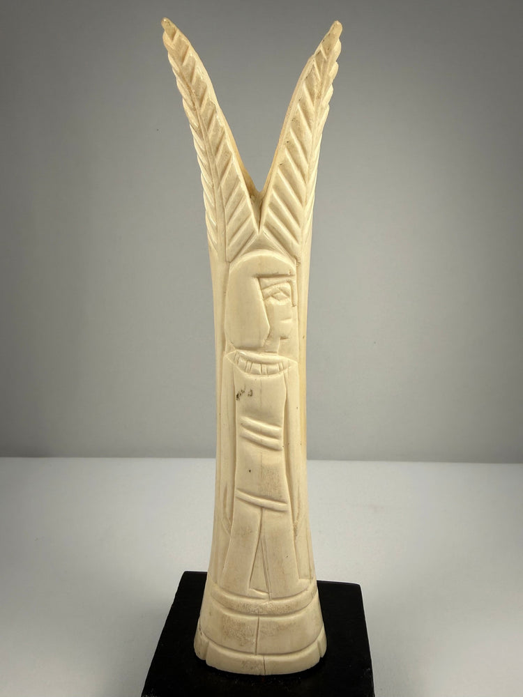 Egyptian revival candlestick holders in carved bone with symbolic floral and plant motifs