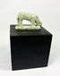 Small Egyptian faience shrew amulet from the Late Period, green glaze traces and archaeological patina.
