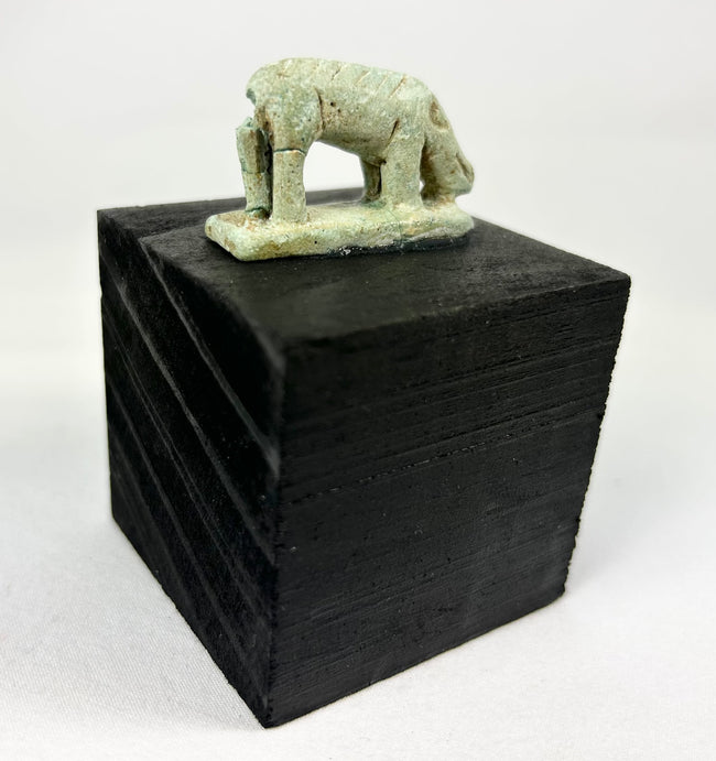 Ptolemaic era Egyptian shrew votive figure, faience with weathered glaze and ancient break through plinth.