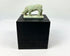 Ancient Egyptian faience shrew amulet, Late Period to Ptolemaic, pale green glaze with burial encrustations, mounted on display stand.