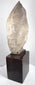 Side view of the Egyptian Revival pharaoh head showing its tall White Crown and hardwood base