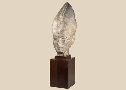 Egyptian Revival pharaoh head sculpture wearing the White Crown on a dark hardwood display stand