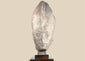 Egyptian Revival pharaoh head sculpture wearing the White Crown on a dark hardwood display stand