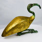 Stylized Egyptian Revival sacred ibis figure with elongated curved beak, red inset eye, and gilt finish.