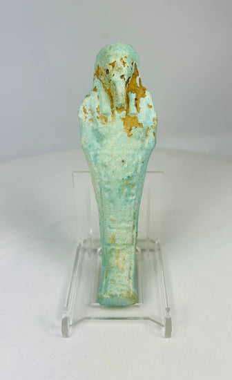 Ancient Egyptian turquoise-blue faience Ushabti standing on a clear display base against a white background