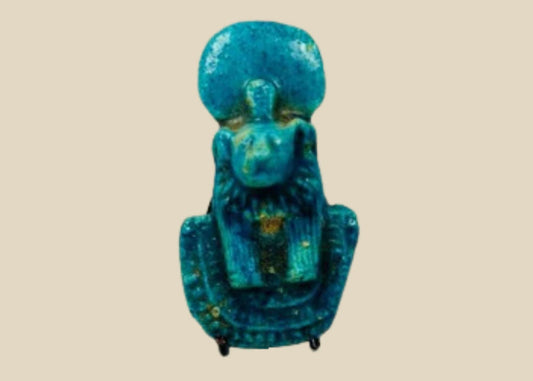 Ancient Egyptian faience amulet depicting Sekhmet, lion-headed goddess of war and protection, turquoise-blue in color with tripartite wig, dual suspension holes, Third Intermediate to Late Period, circa 1070–664 BCE.