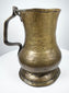 Georgian brass baluster tankard from England with decorative stepped foot, broad body, and traditional handle design.
