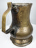 Antique George II brass tankard circa 1727–1760 showing its hand-crafted form, aged brass surface, and historic character.
