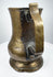 English 18th-century brass ale tankard showing traditional Georgian craftsmanship, cylindrical body, and decorative footed base.