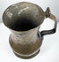George II English brass tankard showing the aged interior, flared mouth, and natural patina developed over centuries.